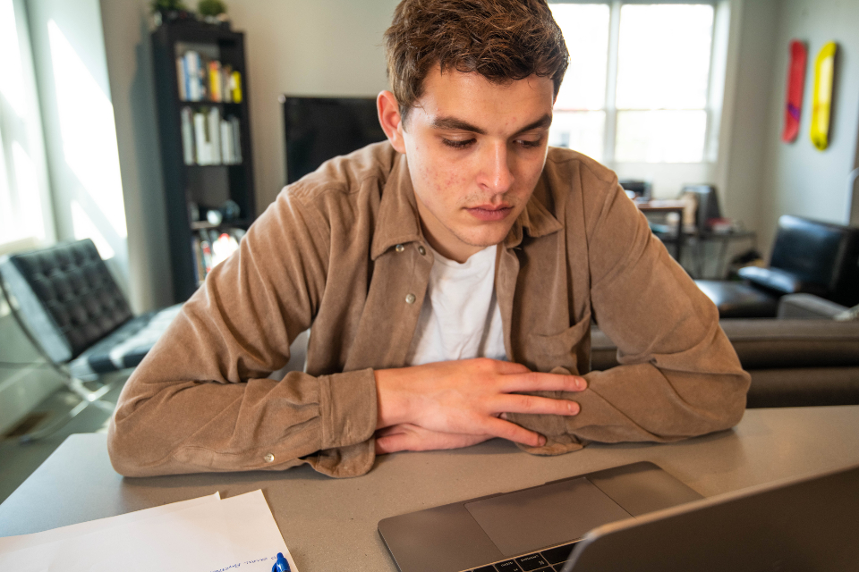 Creator thinking at a laptop for the choosing your niche article