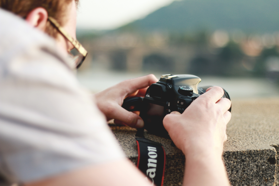 Photographer reviewing footage for the video editing basics article